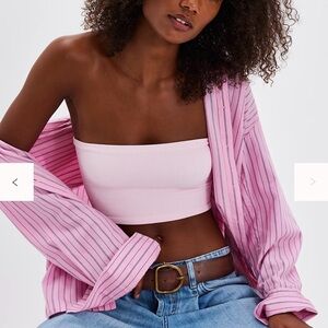 pink tube-style bandeau top featured with ribbed fabrication and a stretch fit.